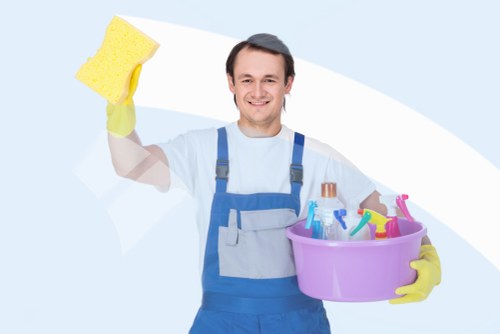 Cleaner preparing a safe cleaning area with caution signs